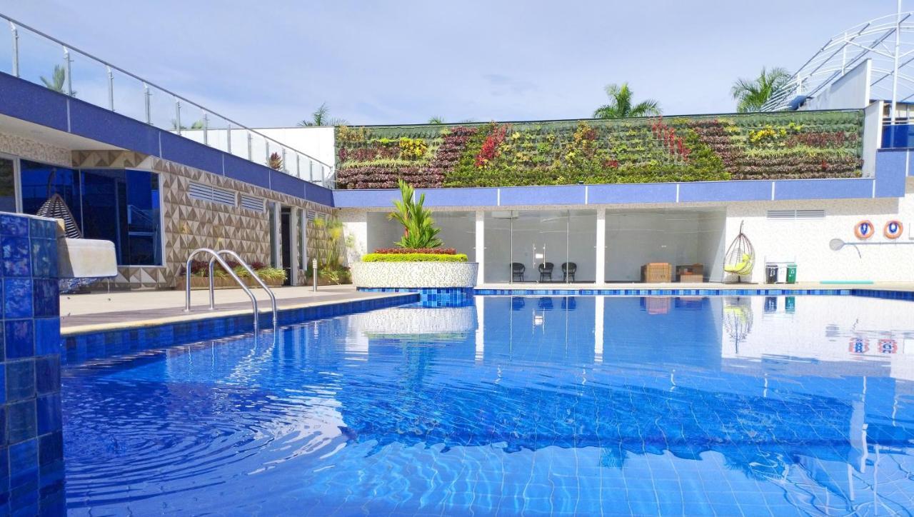 Hotel Royal Elim Internacional Cali Exterior foto The swimming pool at the hotel