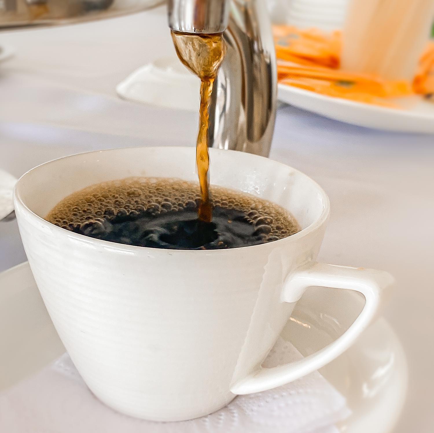 Hotel Royal Elim Internacional Cali Exterior foto Coffee being poured