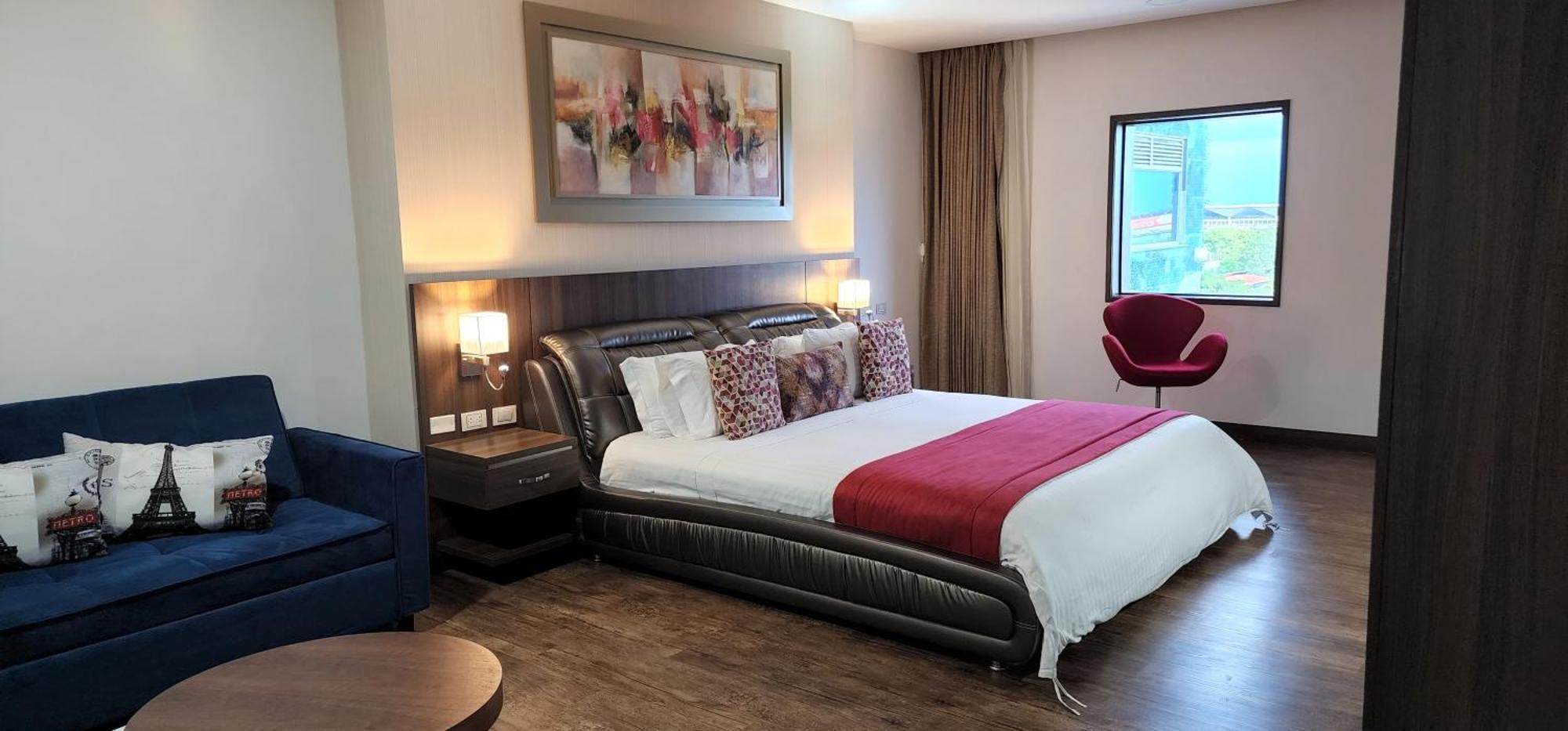 Hotel Royal Elim Internacional Cali Exterior foto A bedroom at the hotel