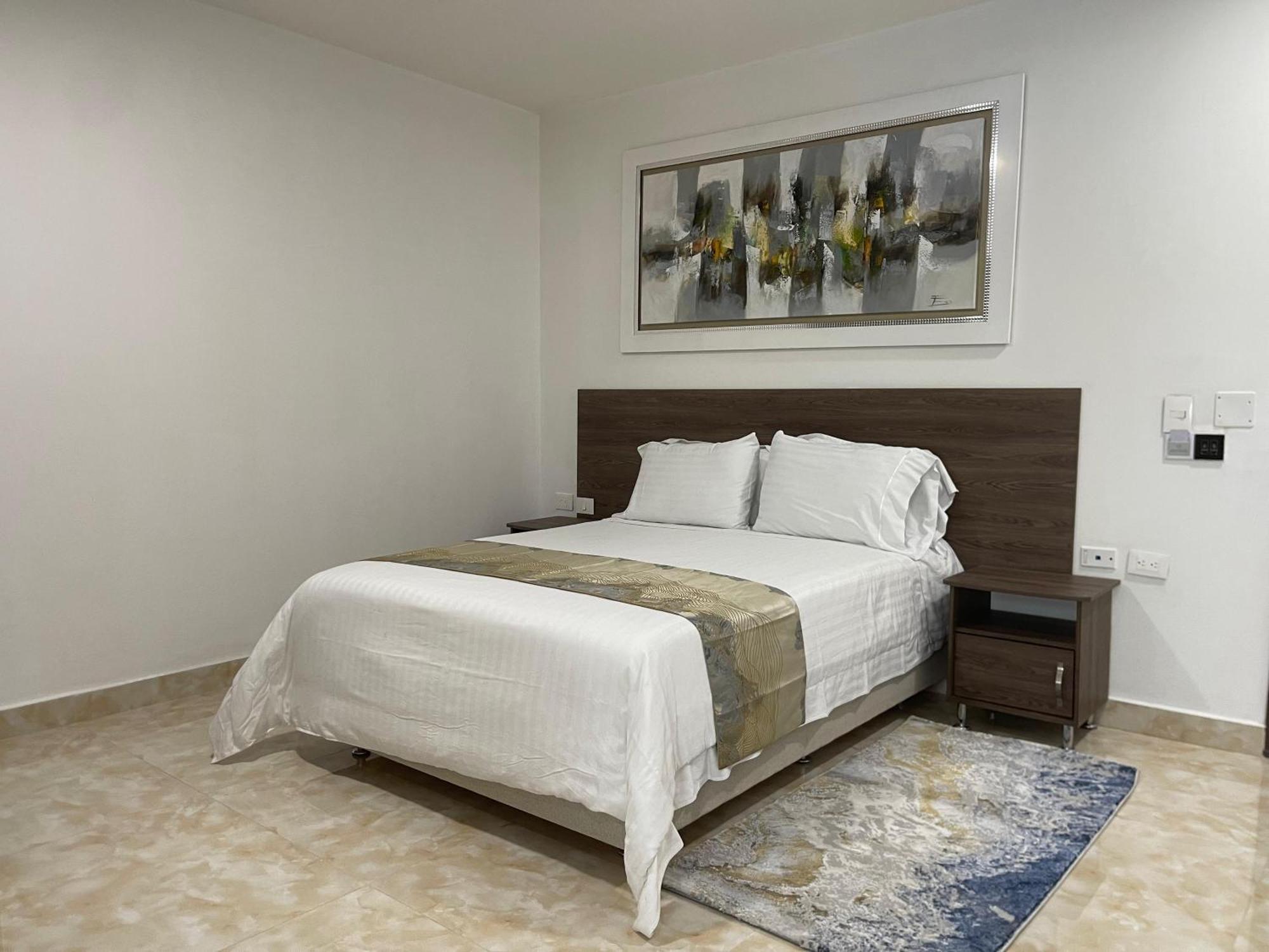 Hotel Royal Elim Internacional Cali Exterior foto A bedroom in the hotel